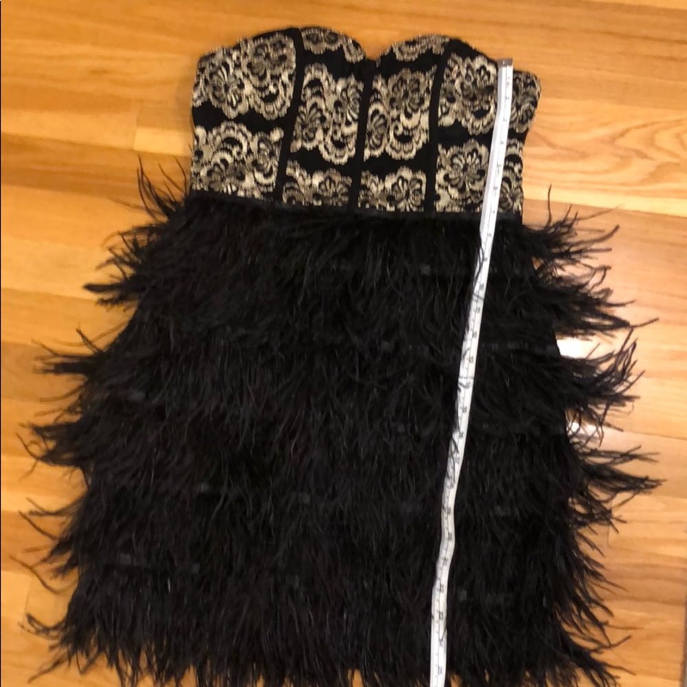 Black and gold feather dress